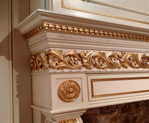 Fireplace mantel decorated with carved and painted wooden moldings